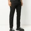 Alexander McQueen dragon patch tapered jeans