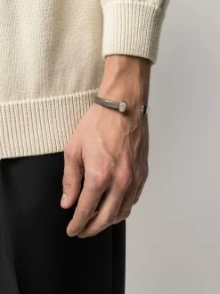 Alexander McQueen skull logo cuff