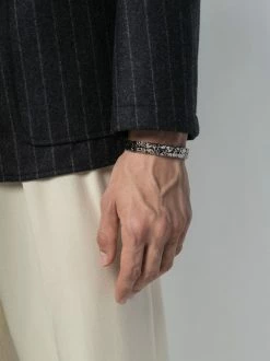 Alexander McQueen skull-engraved cuff bracelet