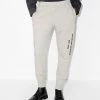 Alexander McQueen graffiti-print track pants