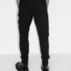 Alexander McQueen Logo graffiti print track pants 7 Alexander McQueen logo graffiti print track pants