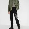 Alexander McQueen Logo graffiti print track pants 9 Alexander McQueen logo graffiti print track pants