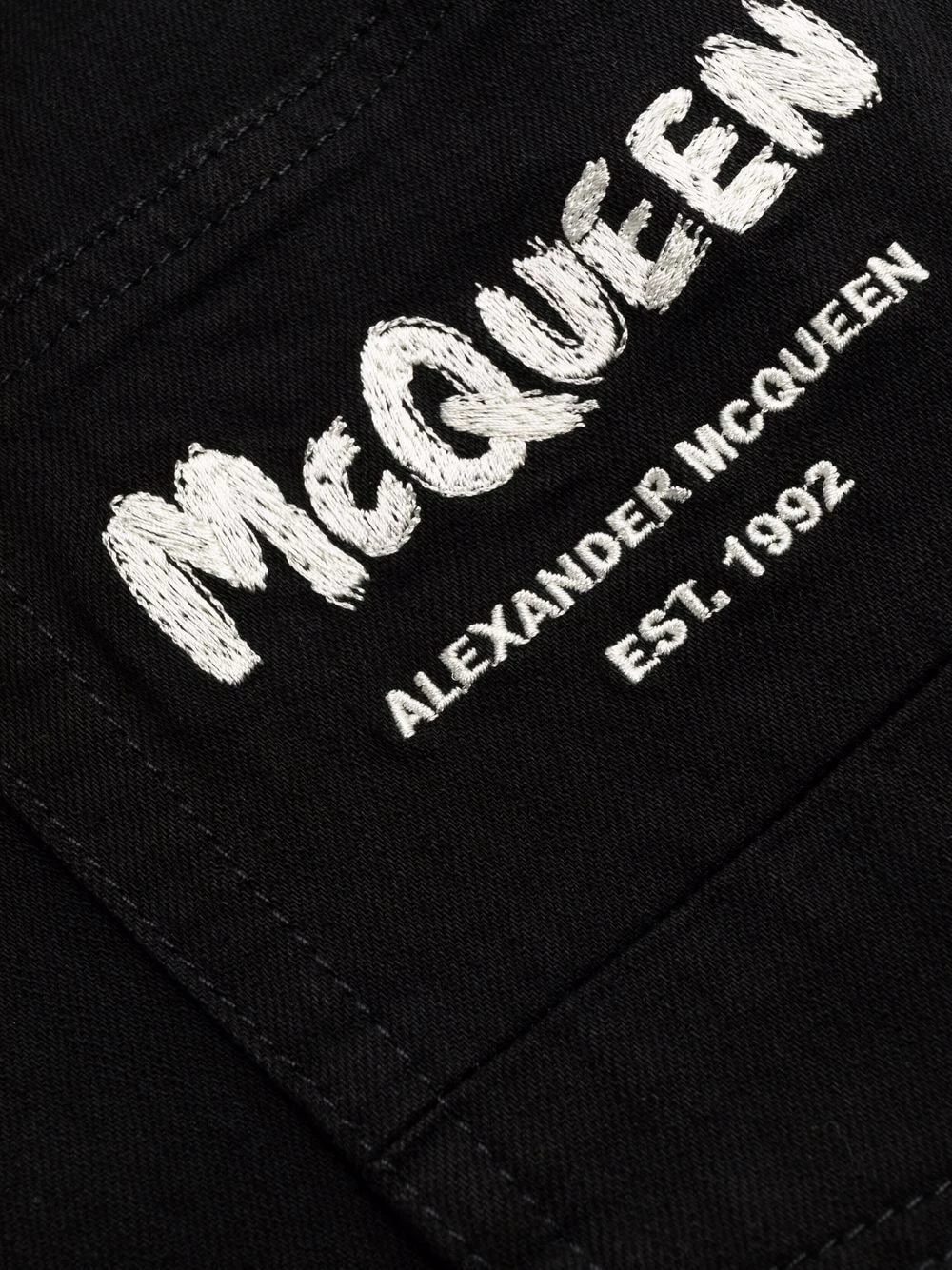 Alexander McQueen Logo print slim cut jeans 7 Alexander McQueen logo-print slim-cut jeans