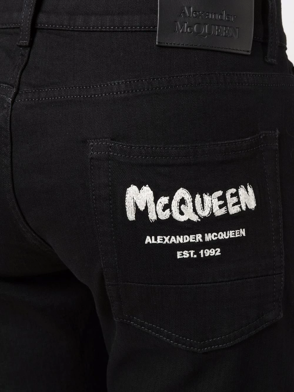 Alexander McQueen Logo print slim cut jeans 5 Alexander McQueen logo-print slim-cut jeans