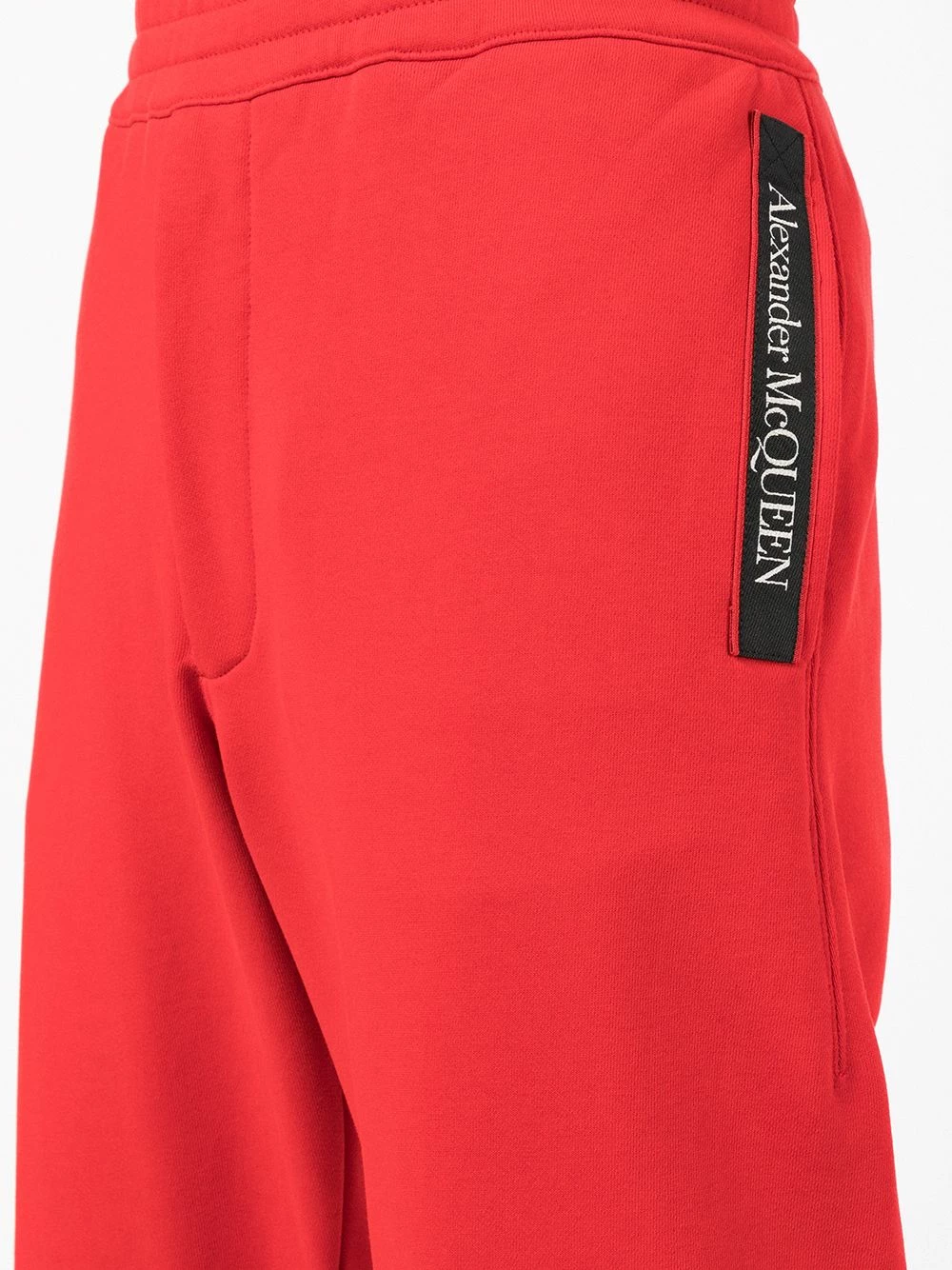 Alexander McQueen Side logo print trousers 5 Alexander McQueen side logo-print trousers